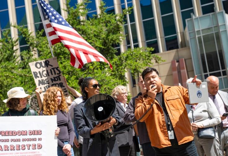 Minneapolis Council Member Jason Chavez speaks at a rally in the wake of June 16, 2026, arrests over protest activities during Operation Metro Surge in a photograph by Aaron Nesheim.