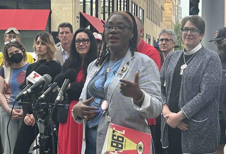 Marcia Howard speaks, backed by many community members including MN15 defendant Gabe.