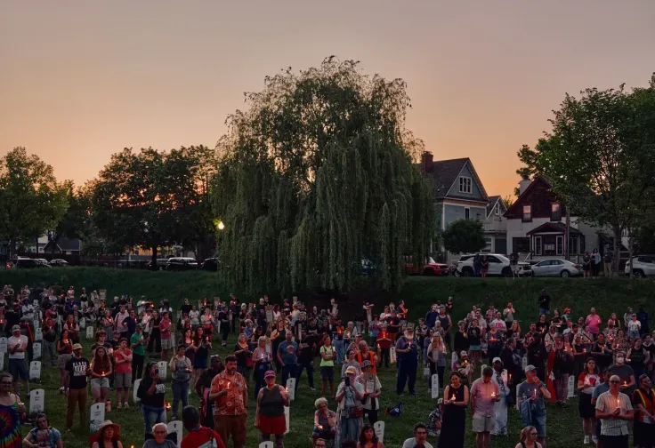 Minneapolis residents attend a candlelight vigil at Memorial Ponds Park during the Annual Rise and Remember Festival, in May, held to commemorate the anniversary of George Floyd’s death.